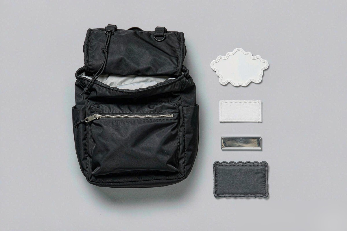 Custom logo options for bags: embroidered patch, metal plate, woven label, silicone patch