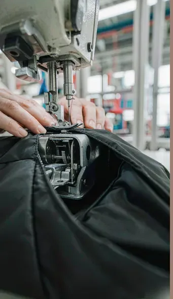 Industrial sewing machine close-up in Kovoeky bag factory